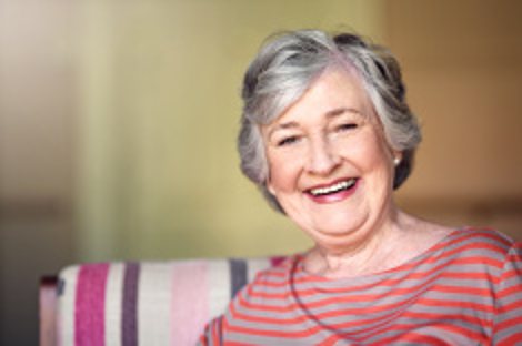 Smiling older woman at home